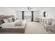 Bedroom with a large window, blue curtains, and stylish furniture at 15336 Serene Shores Loop, Bradenton, FL 34211