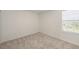 Carpeted bedroom featuring a window with blinds and white walls at 15336 Serene Shores Loop, Bradenton, FL 34211