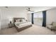 Beautiful bedroom features a ceiling fan, large window, and neutral decor at 15336 Serene Shores Loop, Bradenton, FL 34211