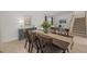 Beautiful dining room showcasing a sleek table and chairs, next to a staircase leading upstairs at 15336 Serene Shores Loop, Bradenton, FL 34211