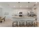 Spacious kitchen with an island featuring pendant lighting, granite countertops, and stainless steel appliances at 15336 Serene Shores Loop, Bradenton, FL 34211