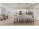 Well-lit kitchen featuring an island, granite countertops, stainless steel appliances, and seating for four at 15336 Serene Shores Loop, Bradenton, FL 34211
