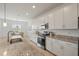 Well-lit kitchen with granite countertops and stainless steel appliances at 15336 Serene Shores Loop, Bradenton, FL 34211