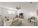 Open living area with plush seating, a TV, and a ceiling fan at 15336 Serene Shores Loop, Bradenton, FL 34211