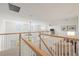 Bright upstairs loft area with railings, carpet and a relaxed seating area at 15336 Serene Shores Loop, Bradenton, FL 34211