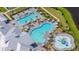 High aerial shot of a community pool area featuring a lap pool, freeform pool, and ' splash zone at 15336 Serene Shores Loop, Bradenton, FL 34211