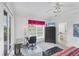 Bright bedroom with workspace, large window, and view of the en-suite bathroom at 1613 Gondola Park Dr # 1613, Venice, FL 34292