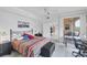 Comfortable bedroom with workspace and access to outdoor balcony at 1613 Gondola Park Dr # 1613, Venice, FL 34292