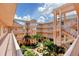Well maintained courtyard surrounded by multistory condos, stairways and walkways at 1613 Gondola Park Dr # 1613, Venice, FL 34292