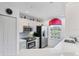 Bright kitchen featuring stainless steel appliances and white cabinetry at 1613 Gondola Park Dr # 1613, Venice, FL 34292