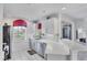 Contemporary kitchen with white cabinets, sleek countertops, and stainless steel appliances at 1613 Gondola Park Dr # 1613, Venice, FL 34292