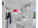 Kitchen area featuring quartz countertops, stainless steel appliances, and a tile backsplash at 1613 Gondola Park Dr # 1613, Venice, FL 34292