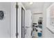 Convenient laundry room equipped with a washer, a dryer, and storage shelves at 1613 Gondola Park Dr # 1613, Venice, FL 34292