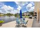 The patio offers a lake view, outdoor seating, and a grill, perfect for relaxing and entertaining at 1613 Gondola Park Dr # 1613, Venice, FL 34292