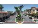 Charming downtown street featuring vibrant shops, palm trees, and well-maintained sidewalks at 1613 Gondola Park Dr # 1613, Venice, FL 34292
