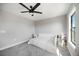 Bright bedroom with a large window and ceiling fan at 16418 Slate Pl, Lakewood Ranch, FL 34211