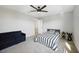 A cozy bedroom featuring a comfortable bed, sofa, and ample space at 16418 Slate Pl, Lakewood Ranch, FL 34211