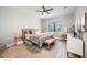 Bedroom features a modern ceiling fan, chic vanity, and window with beautiful view at 16418 Slate Pl, Lakewood Ranch, FL 34211