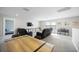 Upstairs bonus room features plush seating, a TV, and a table with chairs at 16418 Slate Pl, Lakewood Ranch, FL 34211