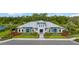 Modern clubhouse with manicured landscaping, offering a welcoming community space at 16418 Slate Pl, Lakewood Ranch, FL 34211