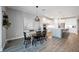 Dining space with modern lighting, and open concept view of the contemporary kitchen with stainless steel appliances at 16418 Slate Pl, Lakewood Ranch, FL 34211