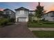 Two-story home with lovely landscaping and brick driveway at 16418 Slate Pl, Lakewood Ranch, FL 34211