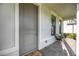 Inviting front porch with decorative tiling and furniture at 16418 Slate Pl, Lakewood Ranch, FL 34211