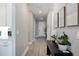 Hallway with wooden floors and modern artwork at 16418 Slate Pl, Lakewood Ranch, FL 34211