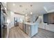 Beautiful kitchen with a large center island, stainless steel appliances, and open access to the living area at 16418 Slate Pl, Lakewood Ranch, FL 34211