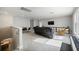 Spacious living room with plush seating, media center, and comfortable furnishings at 16418 Slate Pl, Lakewood Ranch, FL 34211