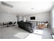 Spacious living room with plush seating, media center, and comfortable furnishings at 16418 Slate Pl, Lakewood Ranch, FL 34211