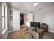 Home office with wood-look floors, modern desk, and natural light at 16418 Slate Pl, Lakewood Ranch, FL 34211