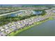 Waterfront neighborhood with homes by winding lakes, all fitted with solar panels on their roofs at 17850 Polo Trl, Bradenton, FL 34211