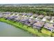 Waterfront neighborhood featuring homes with screened pools and solar panels on the roofs at 17850 Polo Trl, Bradenton, FL 34211