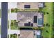 Bird's eye view of a home with solar panels and a screened pool area in a residential neighborhood at 17850 Polo Trl, Bradenton, FL 34211