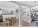Charming dining room with plenty of light, seating for six, and views into living area at 17850 Polo Trl, Bradenton, FL 34211