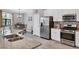 Kitchen area featuring stainless steel appliances, granite countertops, and bright cabinetry at 17850 Polo Trl, Bradenton, FL 34211