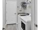 Laundry room with modern appliances, shelves, and storage at 17850 Polo Trl, Bradenton, FL 34211