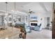 Bright living room showcasing open layout with views to other rooms, fireplace, and coastal-inspired accents at 17850 Polo Trl, Bradenton, FL 34211