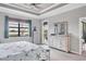 Main bedroom with a large window that offers tranquil outdoor views at 17850 Polo Trl, Bradenton, FL 34211