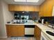 Functional kitchen featuring a double sink, and modern appliances, offering an easy cooking experience at 1999 Kings Hwy # 26A, Punta Gorda, FL 33980