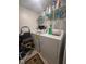 Well-lit laundry room with a washer and dryer; shelving and accessories for doing laundry at 1999 Kings Hwy # 26A, Punta Gorda, FL 33980