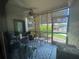 Enclosed porch with furniture and an outdoor view, creating a transition space to the outdoors at 1999 Kings Hwy # 26A, Punta Gorda, FL 33980
