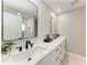 Elegant bathroom with double sinks, modern fixtures, and a bright, clean aesthetic at 2400 Lake Shore Dr, Nokomis, FL 34275