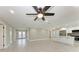Large living area with an open layout and a kitchen view, perfect for entertaining at 2400 Lake Shore Dr, Nokomis, FL 34275