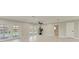 Spacious living area with tiled flooring, French doors to the pool and neutral paint at 2400 Lake Shore Dr, Nokomis, FL 34275