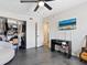 Bright bedroom with modern decor, polished concrete floors, closet, and flat screen TV at 2416 Emory Ave, Bradenton, FL 34207