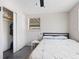 Sunlit bedroom with sliding closet doors, and a window at 2416 Emory Ave, Bradenton, FL 34207