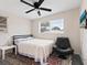 Bright bedroom with light-filled windows, and a stylish chair at 2416 Emory Ave, Bradenton, FL 34207