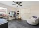 Spacious bedroom featuring polished concrete floors, fan, and window for plenty of natural light at 2416 Emory Ave, Bradenton, FL 34207